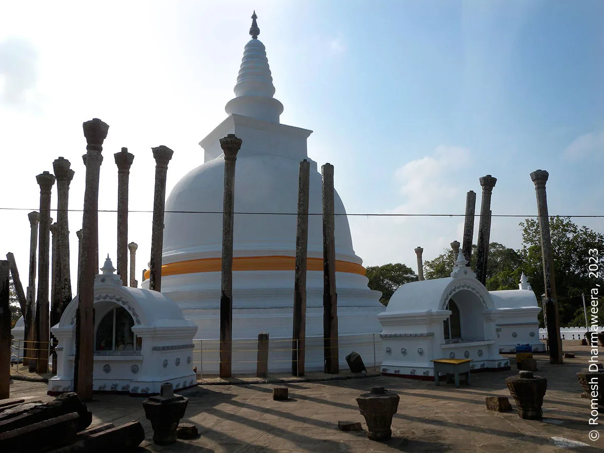 Buddhist dagoba and ancient stone columns in Anuradhapura, Sri Lanka